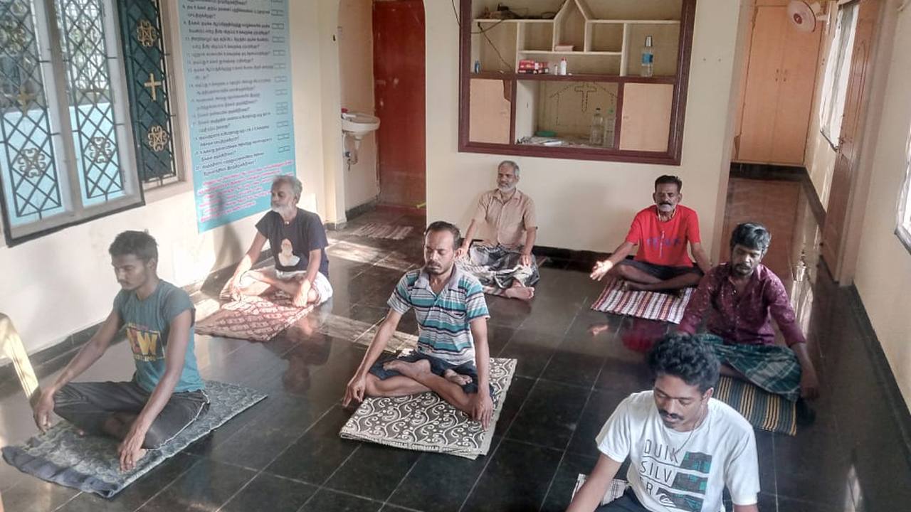 Residents at a morning session in the therapy hall at Dunamis, Madurai
