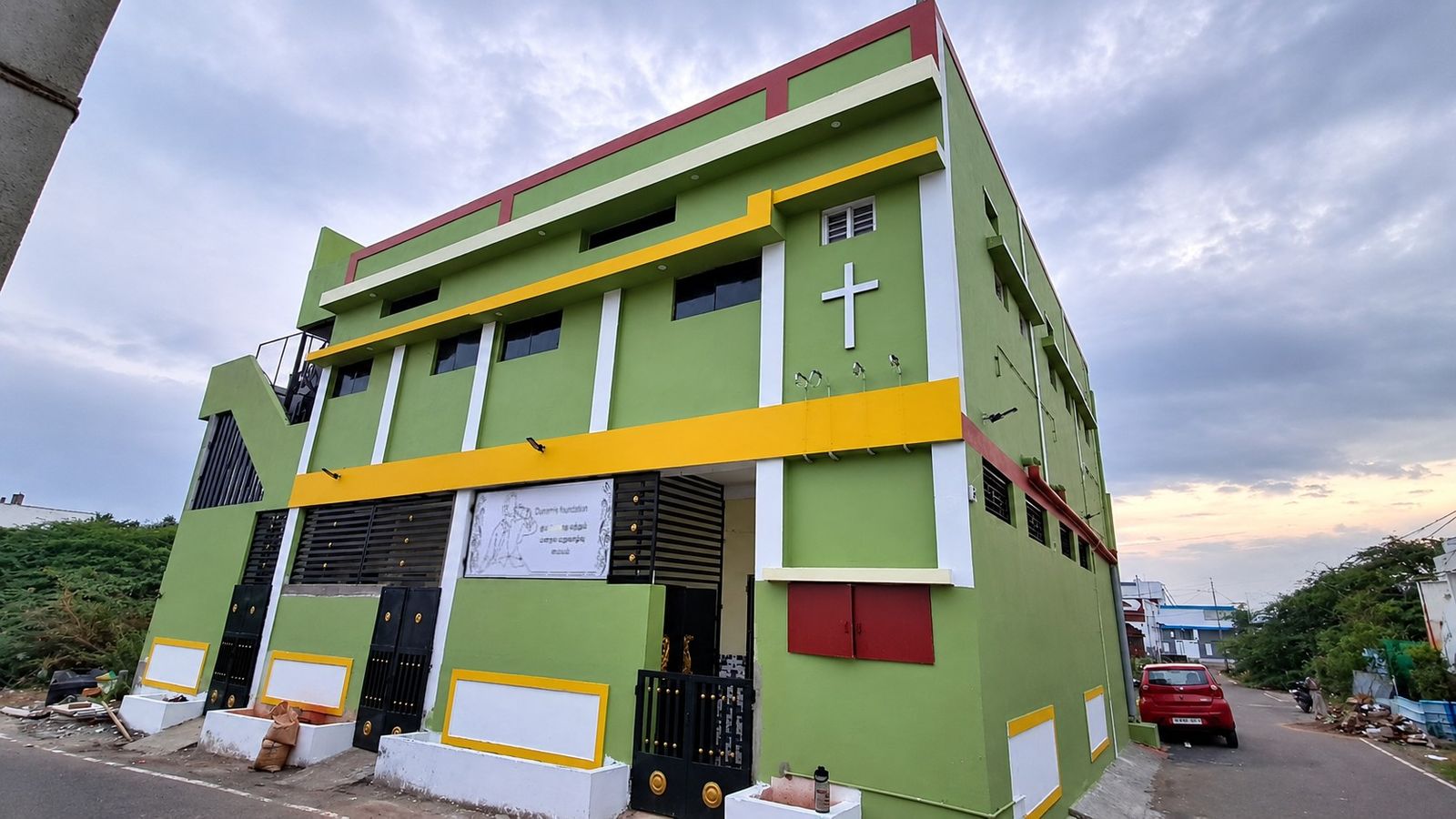 The Dunamis de-addiction centre in Vilangudi, Madurai, seen from the street corner at dusk